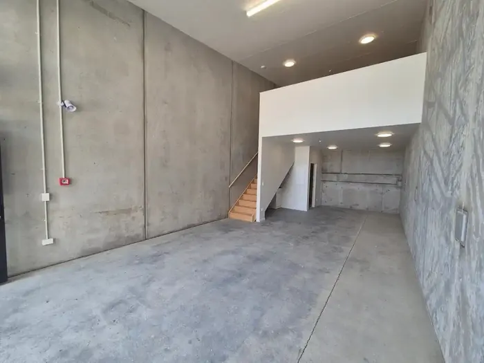 Ground floor warehouse looking toward the stairs and mezzanine